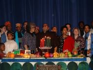A celebration with Maulana Karenga at the center (Image via Wikimedia Commons)